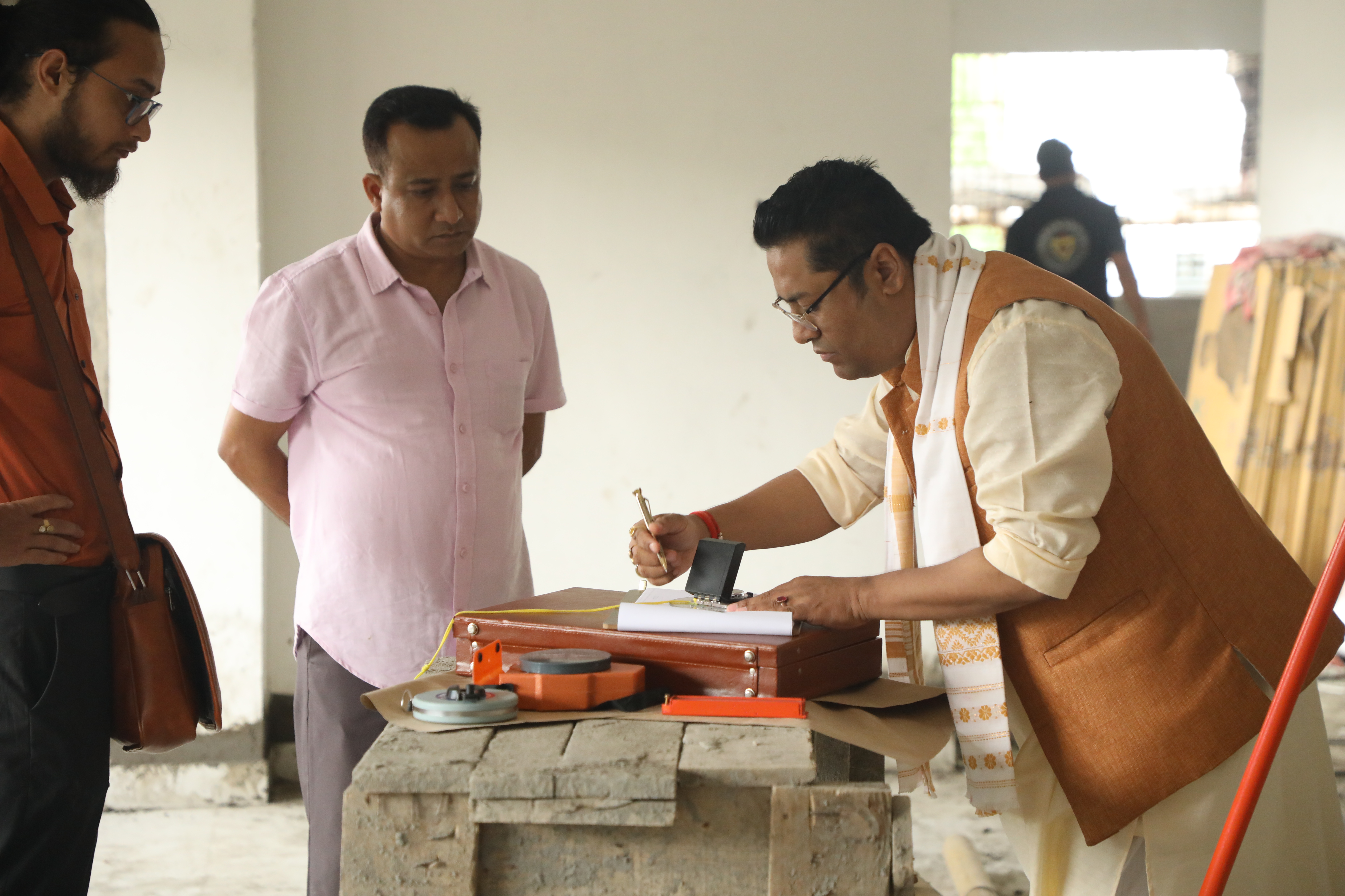 Dr. Vikram Talukdar with a client during a Vastu ceremony