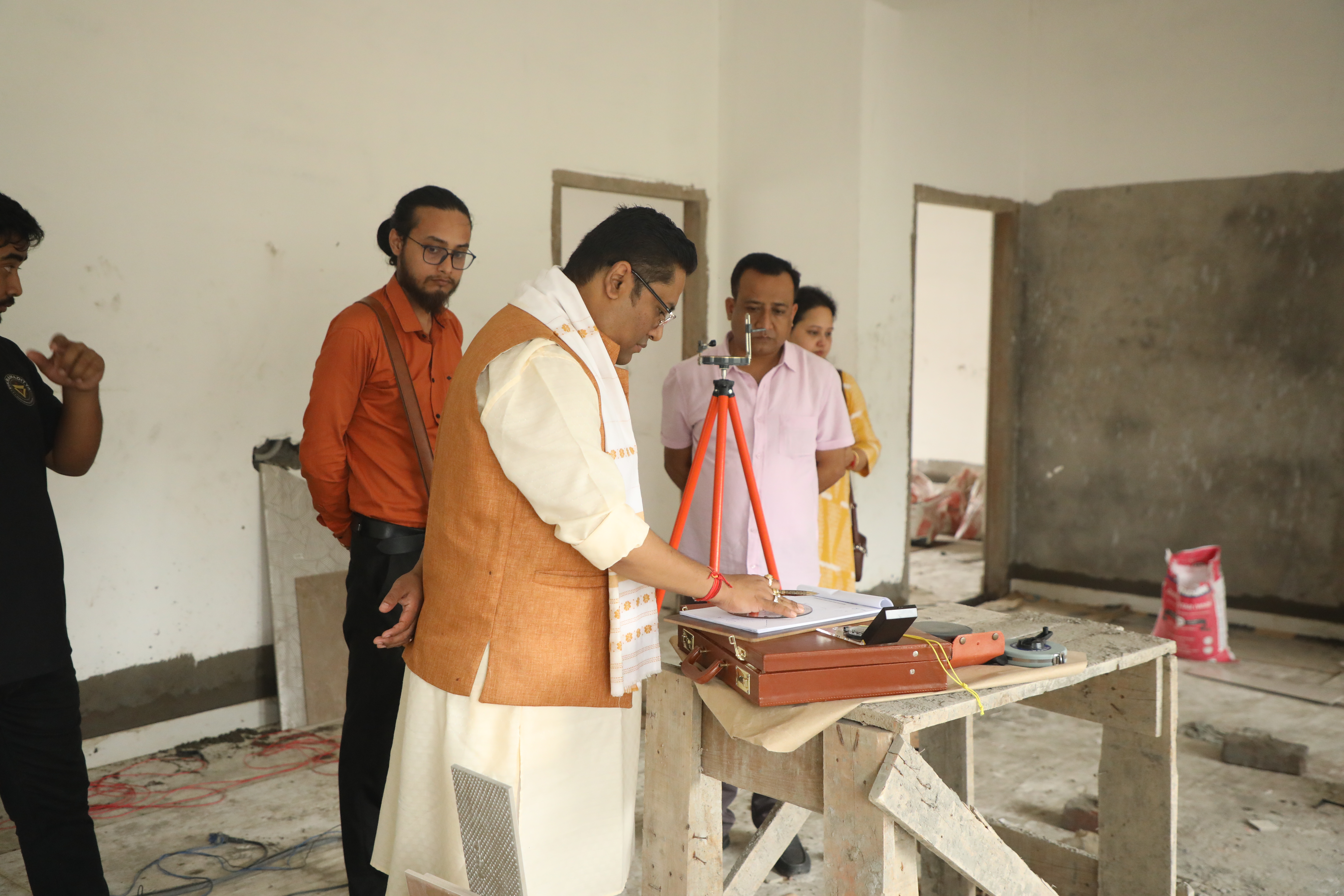 Dr. Vikram Talukdar with clients during a home Vastu visit